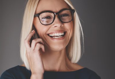 laughing-busineswoman-talking-on-her-cellphone-9K4LH7Z.jpg