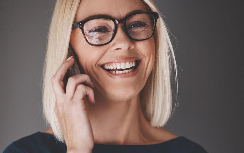laughing-busineswoman-talking-on-her-cellphone-9K4LH7Z.jpg